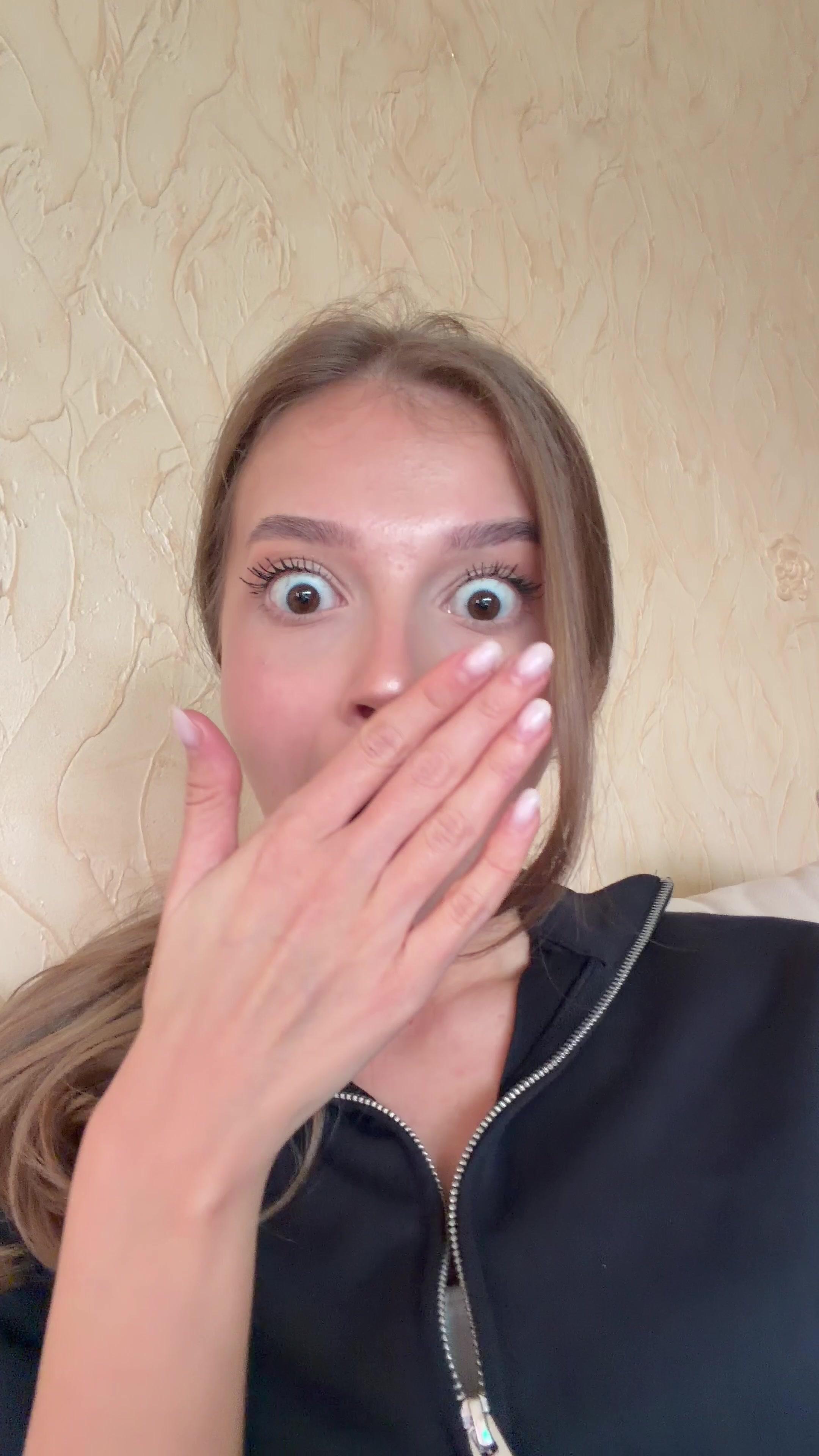 Shocked Young Woman Covering Her Mouth