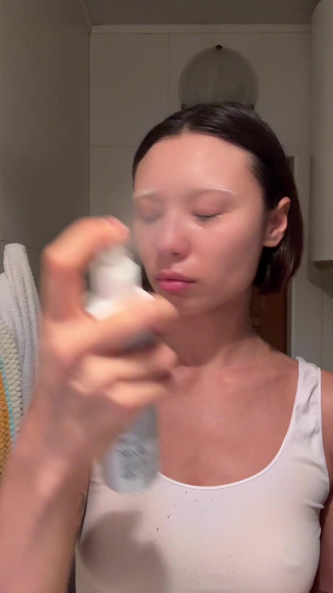 Woman Demonstrating Daily Skincare Routine Steps